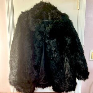 Black fake fur jacket. Served me great at raves and burning man. One size.
